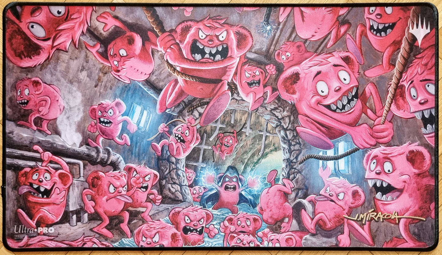Signed B.O.B. (Bevy of Beebles) MTG playmat featuring Jeff Miracola’s Unsanctioned artwork, showing a chaotic swarm of pink Beebles with stitched black edges.