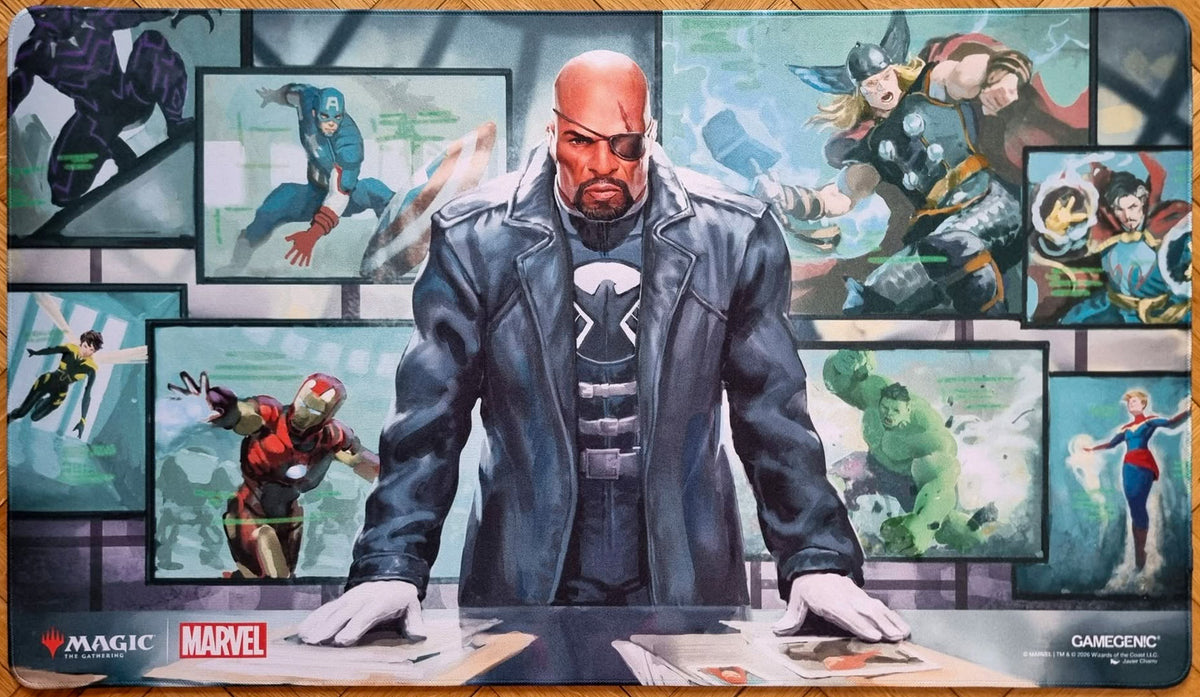 Magic: The Gathering x Marvel Director Nick Fury playmat featuring Javier Charro’s artwork, showing Nick Fury at a command desk surrounded by screens with Marvel heroes and stitched edges.