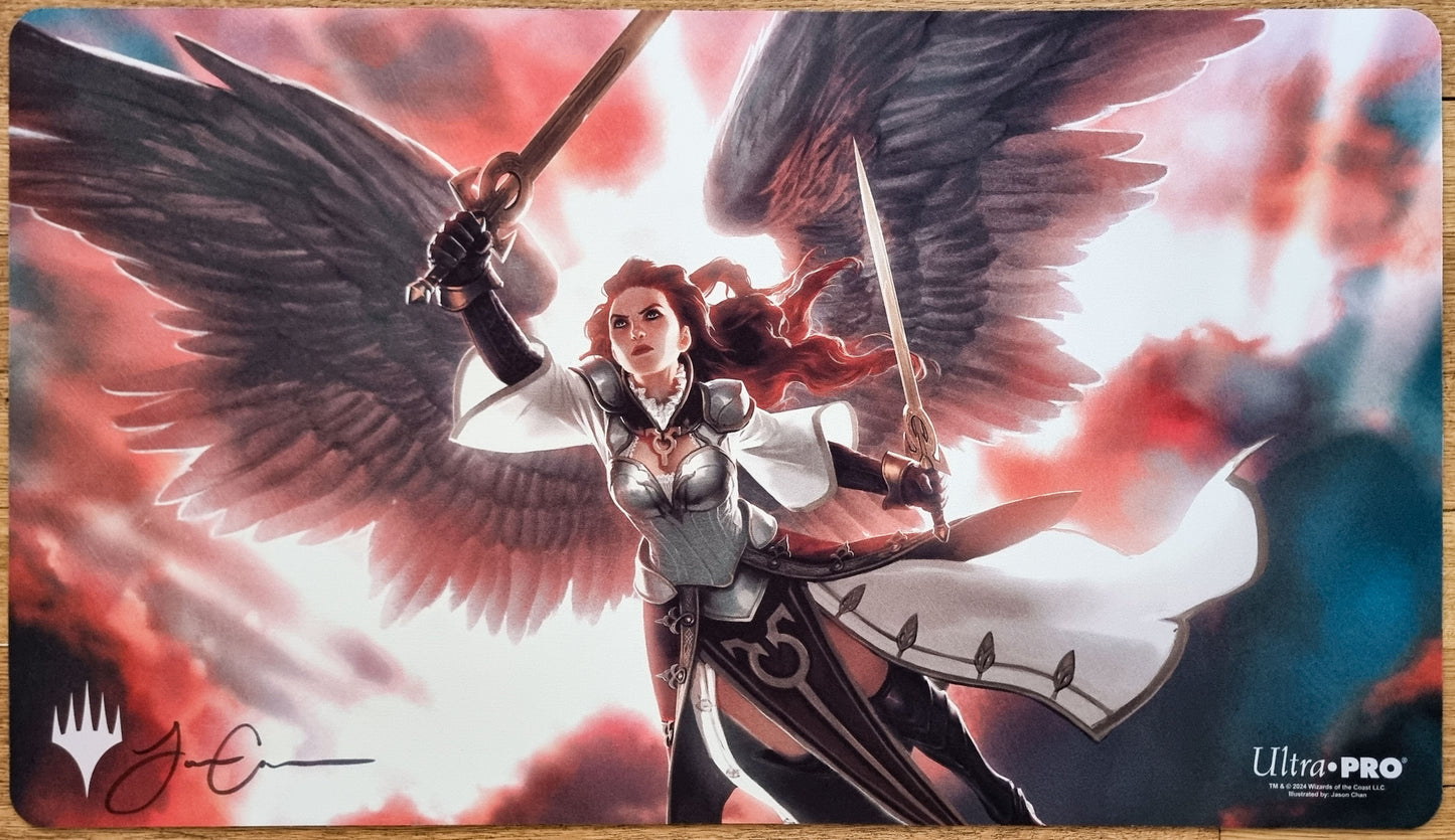 Signed Gisela, Blade of Goldnight MTG playmat by Jason Chan showing a winged angel warrior with two blades against a red-and-white sky.