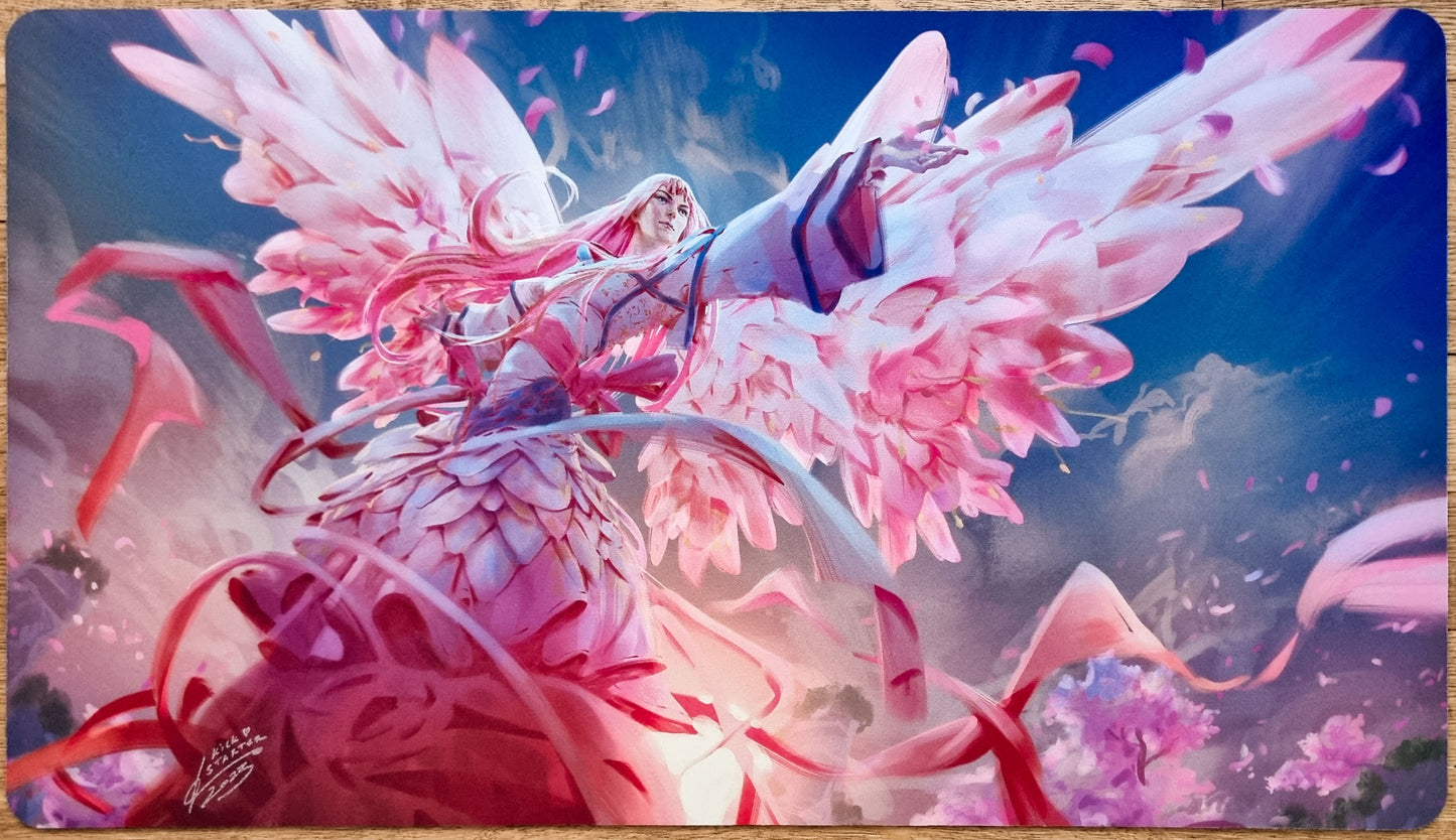 Signed GP Chiba Angel MTG playmat by Johannes Voss showing a pink Sakura-inspired angel with flower wings and flowing ribbons.