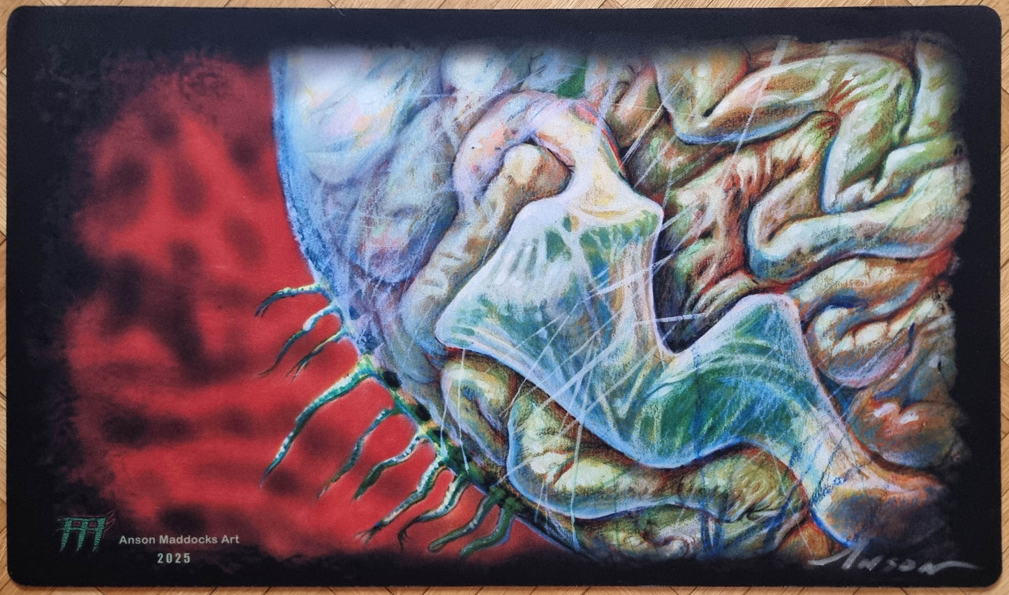 Signed Maze of Ith playmat by Anson Maddocks featuring a surreal close-up of the organic maze creature from The Dark against a deep red background.