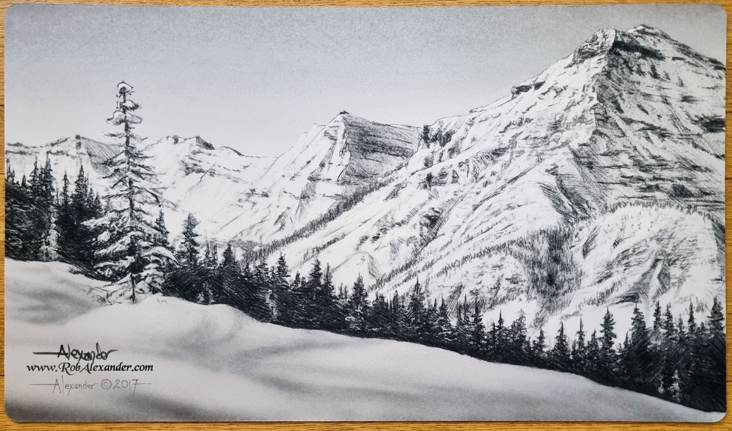 Signed black-and-white Taiga MTG playmat by Rob Alexander showing a mountain range, forest line, and snowy landscape.