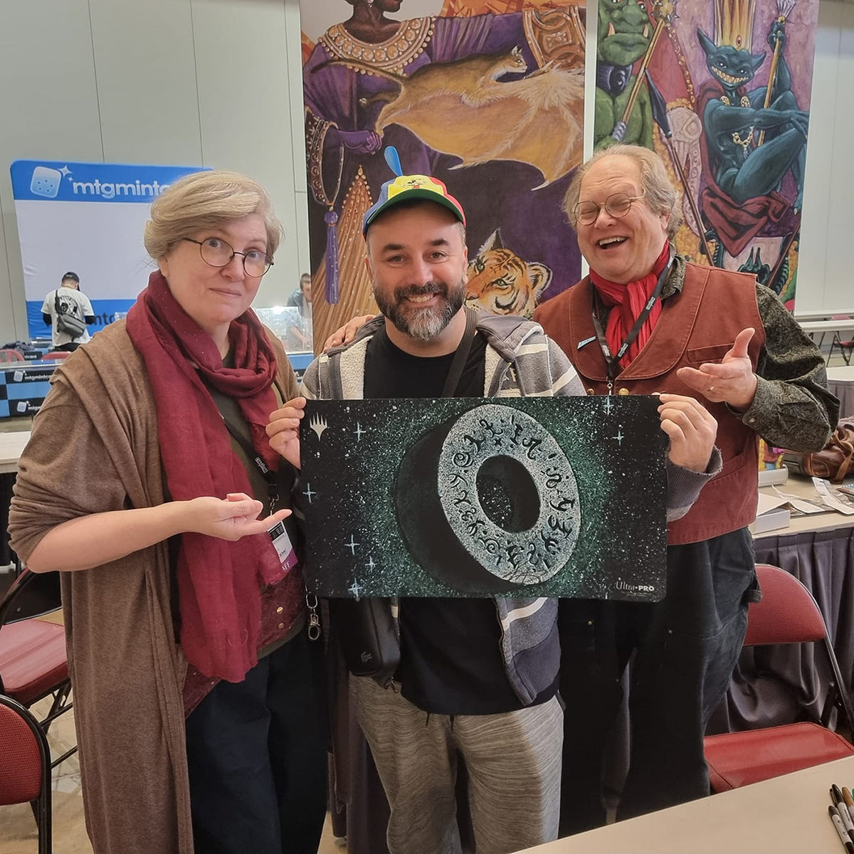 Filippo Lietti, owner of MTGPlaymats, with Kaja and Phil Foglio.