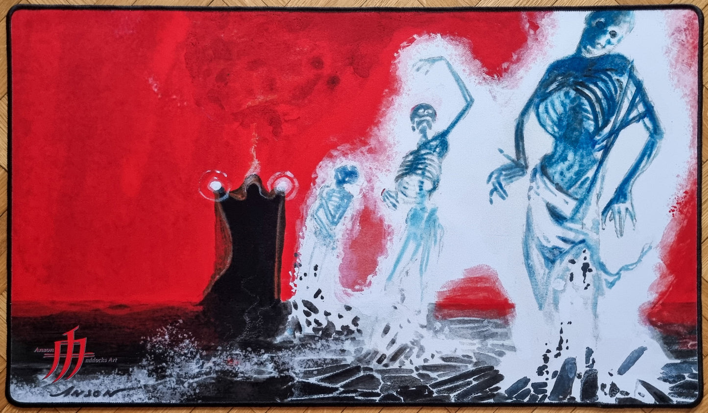 Signed Animate Dead playmat by Anson Maddocks featuring ghostly skeletal figures on a vivid red background, with stitched black edges and Limited Edition Alpha artwork.