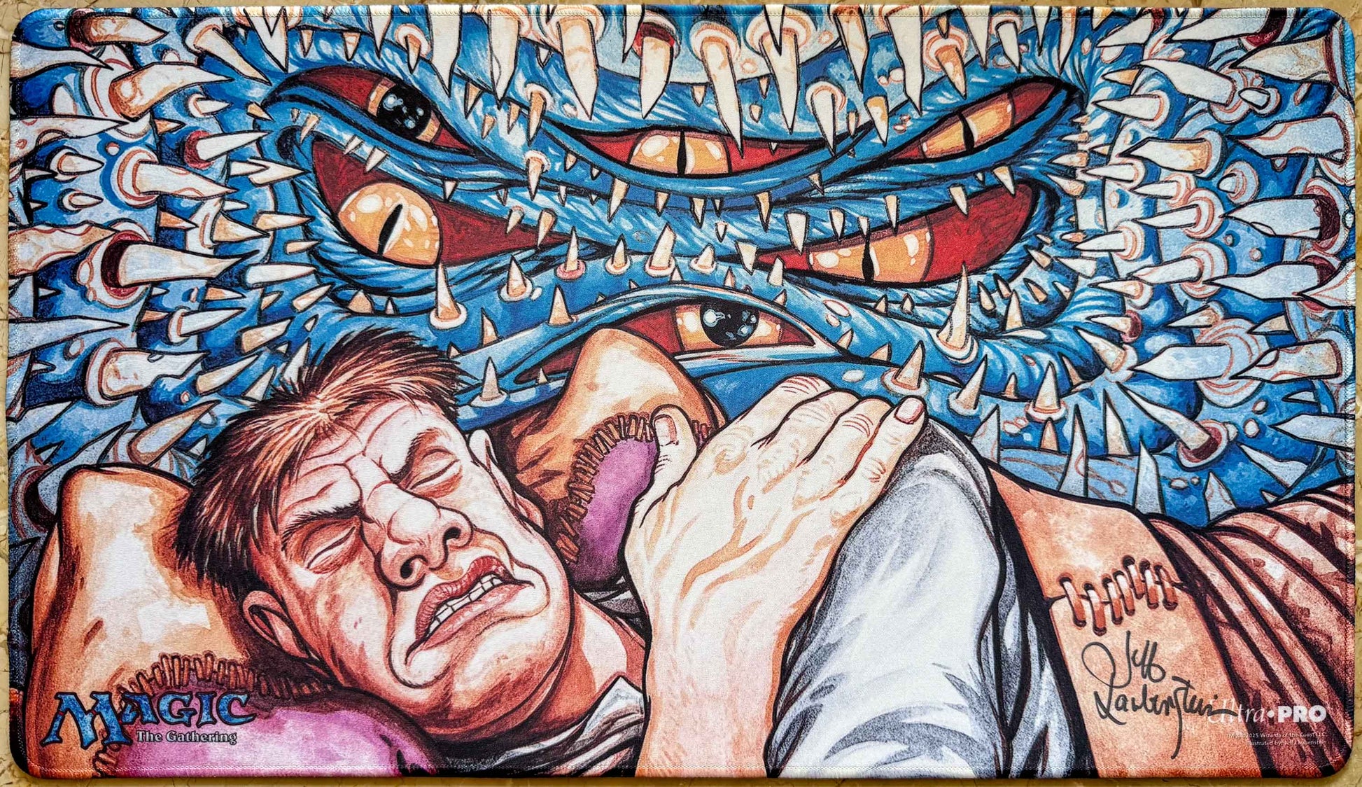 Signed stitched Recurring Nightmare MTG playmat by Jeff Laubenstein with the classic Magic logo, showing a sleeping figure beneath a surreal blue nightmare creature.