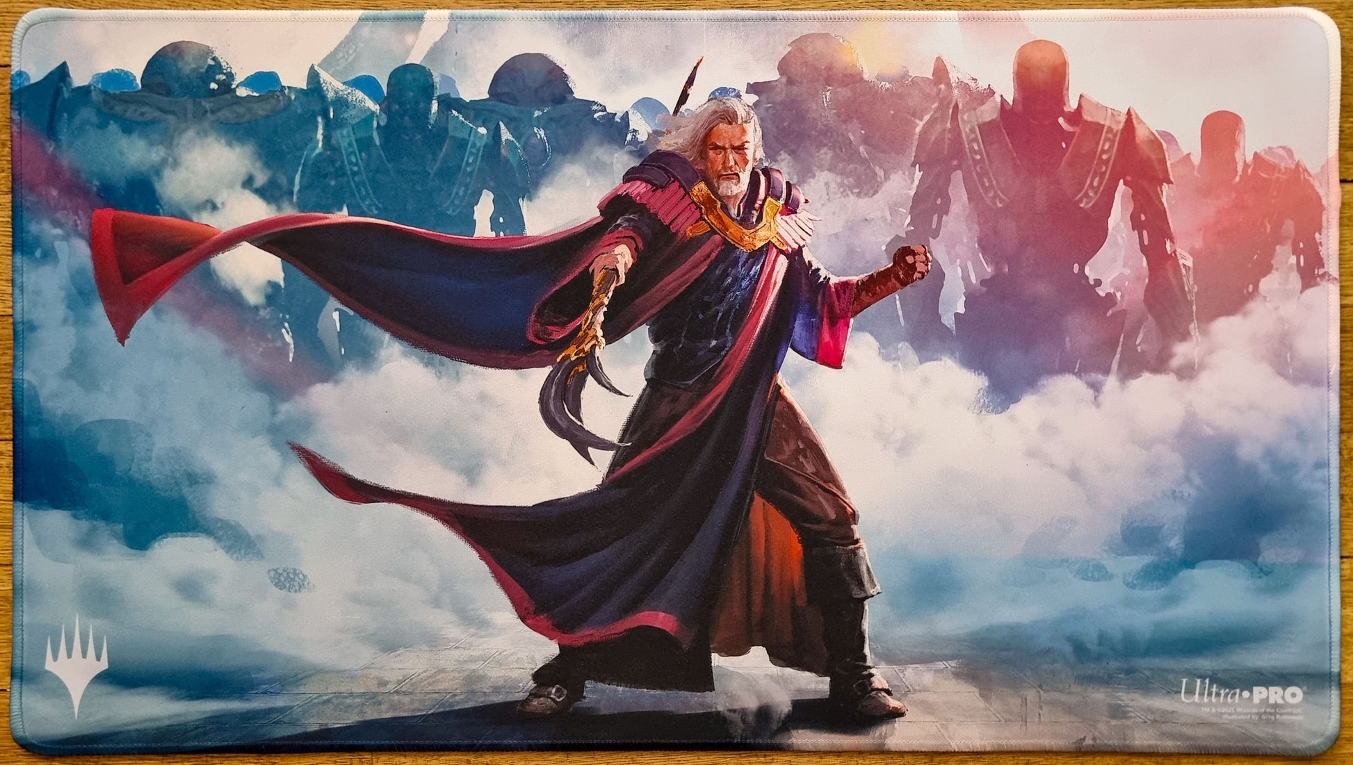 Stitched Urza, Lord High Artificer MTG playmat by Grzegorz Rutkowski showing Urza in front of misty construct silhouettes.