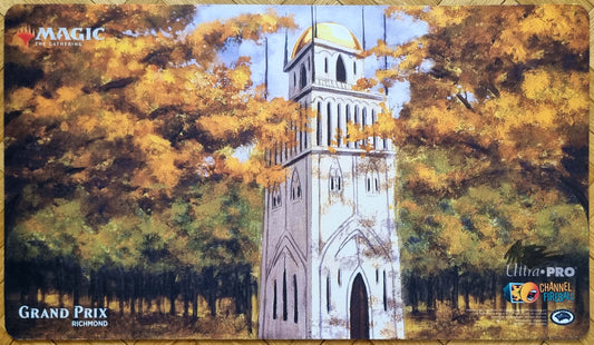 Signed Urza’s Tower Grand Prix Richmond 2018 playmat featuring Mark Poole’s Antiquities autumn artwork, with a white tower rising among golden forest trees.