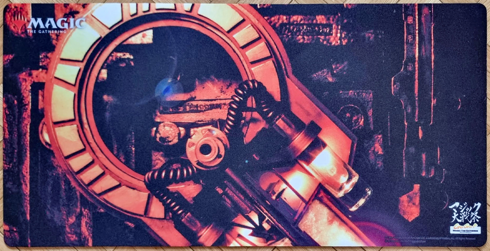Voltaic Key MTG playmat featuring Henry G. Higginbotham’s Urza’s Saga artwork, showing a red-lit industrial artifact mechanism with Magic Taisen Matsuri branding.