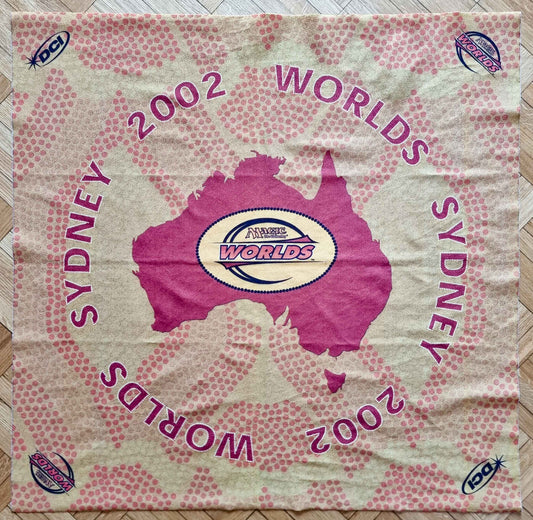 2002 Magic World Championships Sydney square cloth playmat featuring a magenta map of Australia, Worlds and DCI logos, and pink dot-pattern graphics.